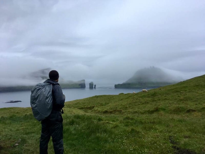 nathan looks out toward the misty faroe islands